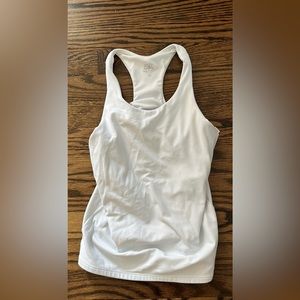 Athleta girls racer back tank in white, shelf bra built in, size 12.